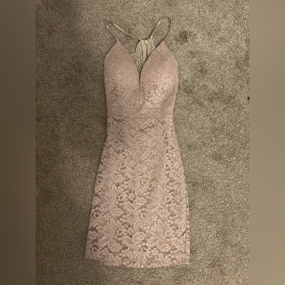 Stretchy but form fitting champagne dress great for homecoming or formal event